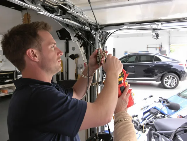 Storrs Garage Door Repair safety certified technician performing cable replacement in Storrs