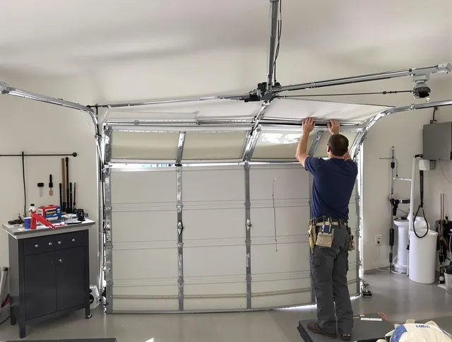 Storrs Garage Door Repair specialist performing precise section replacement on Storrs garage door